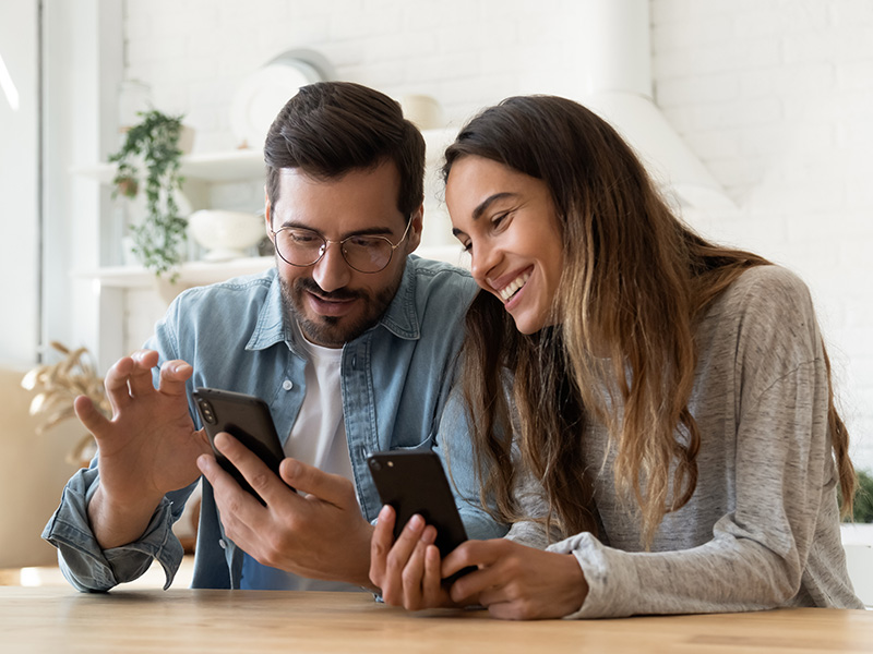A couple deciding on a phone plan.